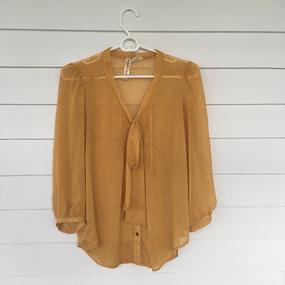 Tie neck blouse.